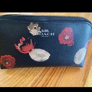 Small Coach pouch. New, never used. Measures 17x4x3.5”